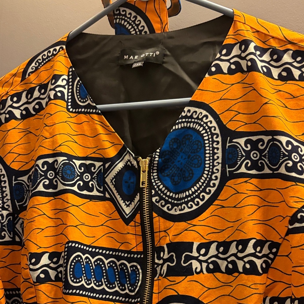 Mae Otto   Vibrant Orange and Blue Patterned top